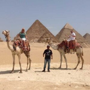 Camel Ride at Giza Pyramids During Sunrise or Sunset